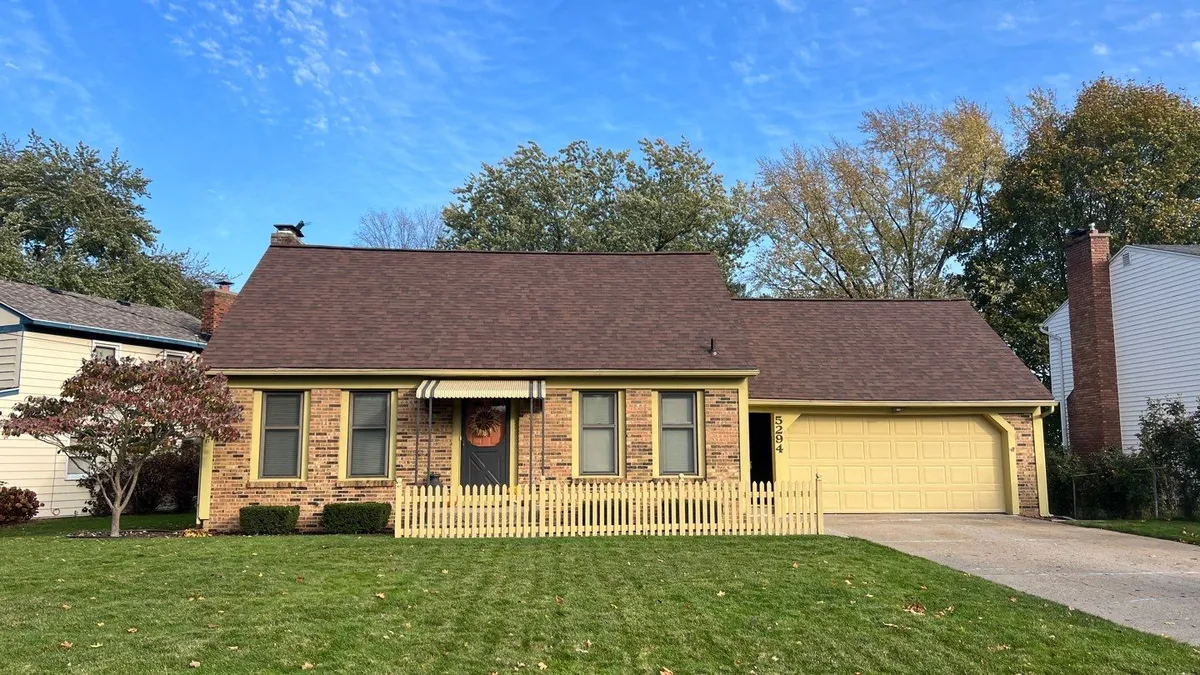 New architectural shingle roof on a brick ranch home in Kentwood, MI after a complete roof replacement by Above Roofing