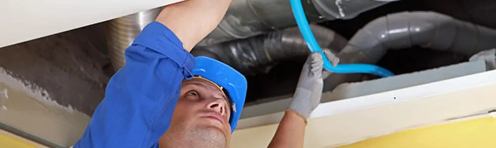 Worker working in a ceiling