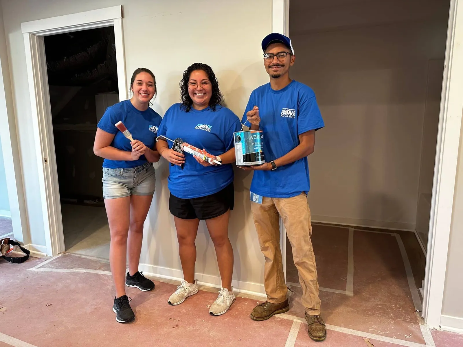 Above Roofing volunteers at Lakeshore Habitat for Humanity