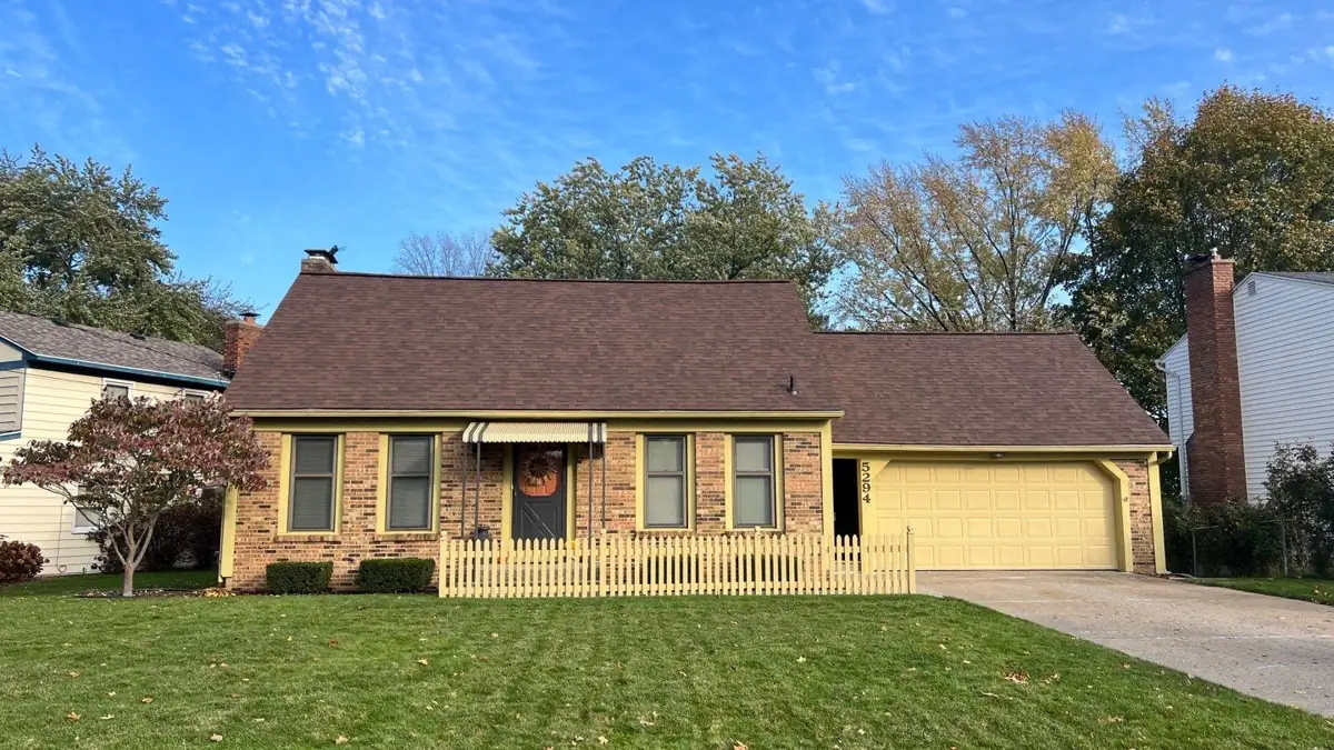 New brown shingle roof on a brick ranch home in Kentwood, MI installed by Above Roofing