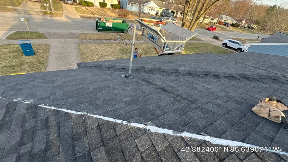 Above Roofing crew installing new shingles on a home in Kentwood, MI