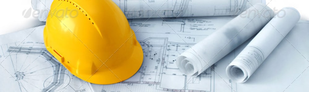 Construction blueprints with a hard hat