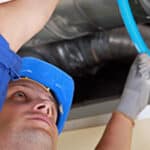 Worker working in a ceiling