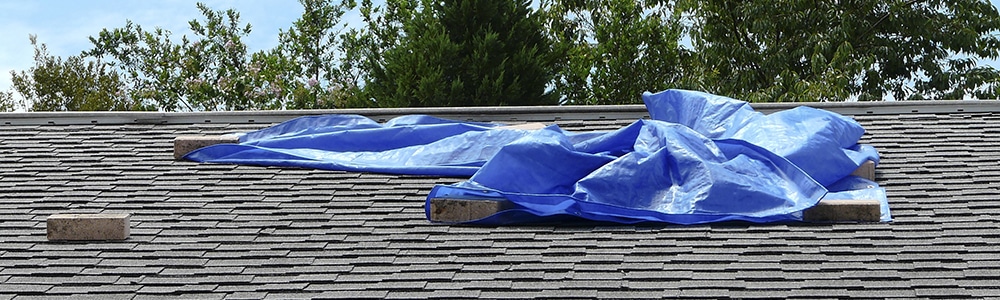 Tarp Covering Residential Roof Leak