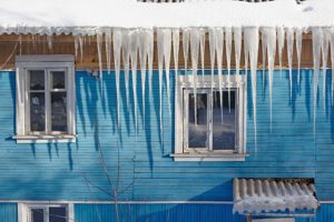 Icicles hanging from a roof may be causing damage to your roofing insulation.
