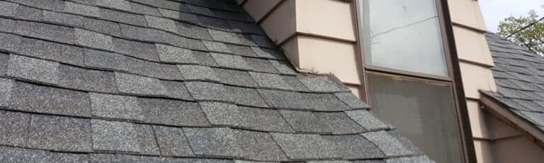 Old roof with curling shingles