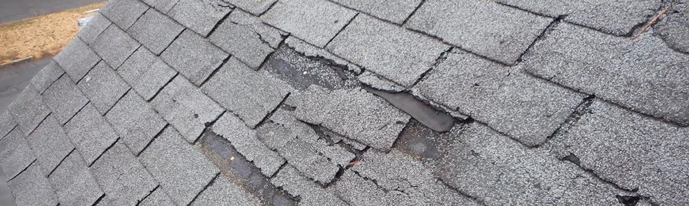 Damaged shingles on a house