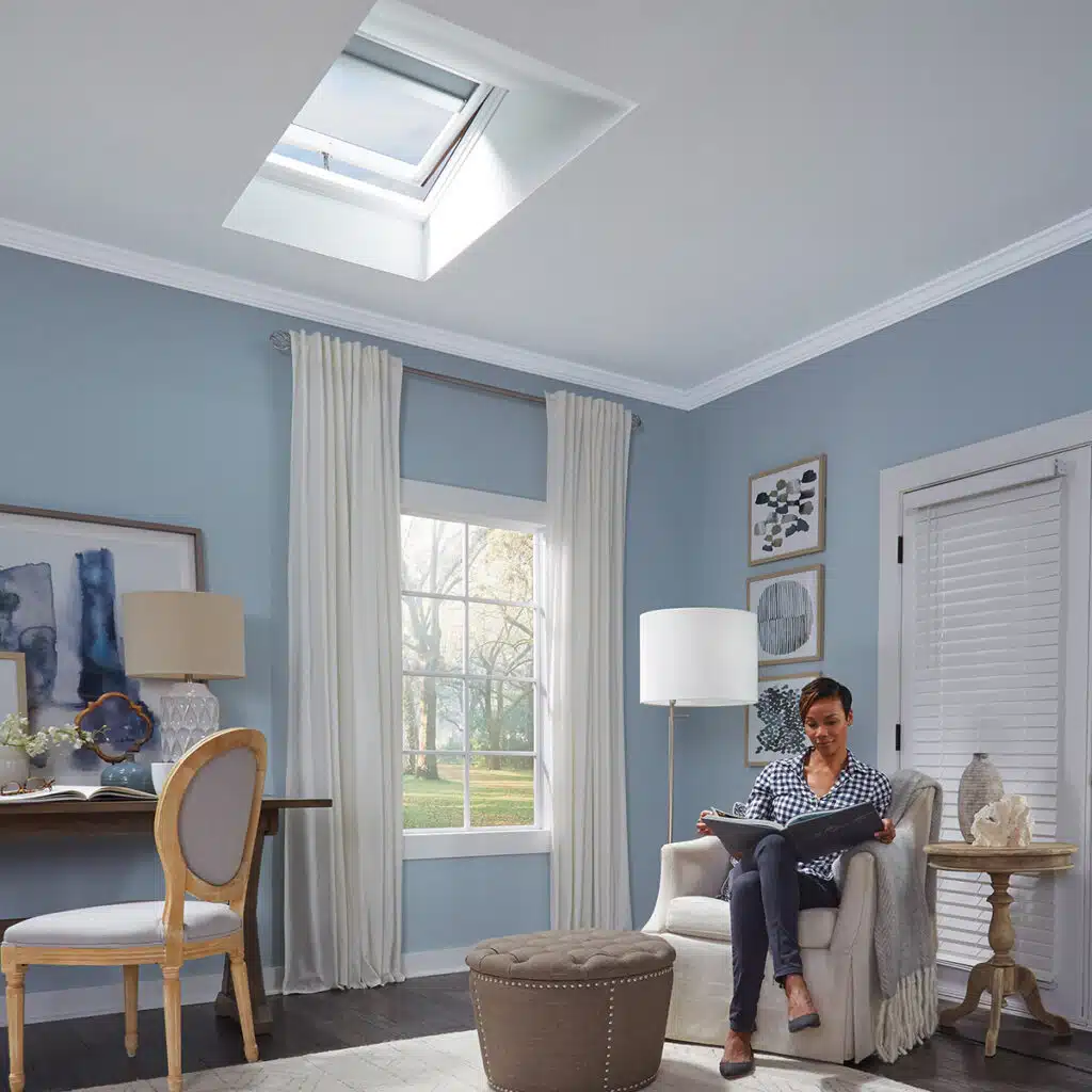 Skylight over woman reading a book