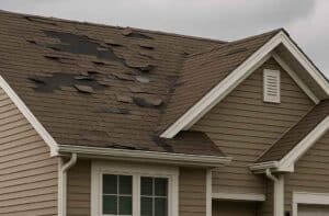 House with damaged roof from a storm